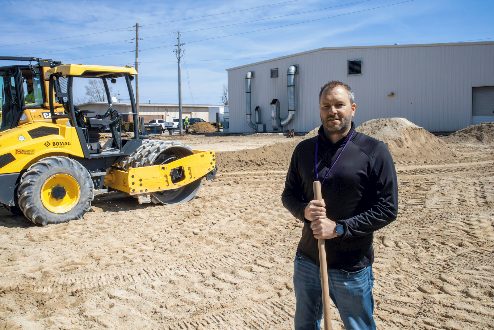 Adam in front of construction site