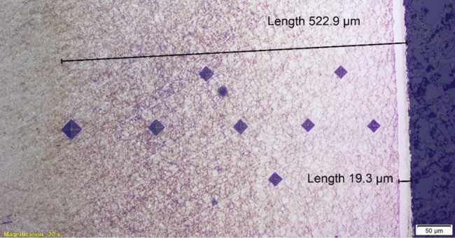 Figure 3. Nitrided medium alloy steel showing compound zone (white layer) at the surface and nitride