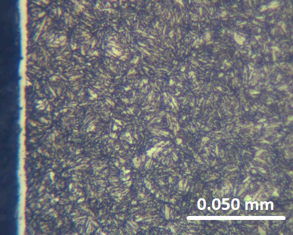 Figure 1 Photo micrograph of the ion nitrided 4340 sample. Nitrided temperature 520° C