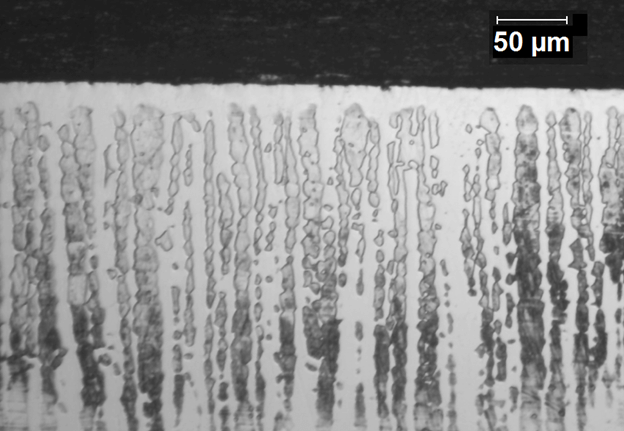 Fig. 5. Optical photomicrograph of 2205 duplex stainless steel sample ion nitrided at 390° C. Note c