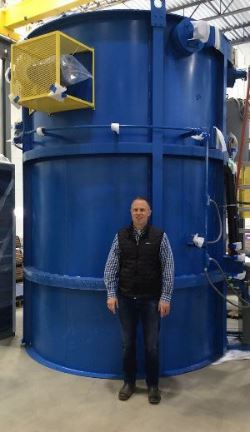 AHT President Mikel Woods with new gas nitriding unit