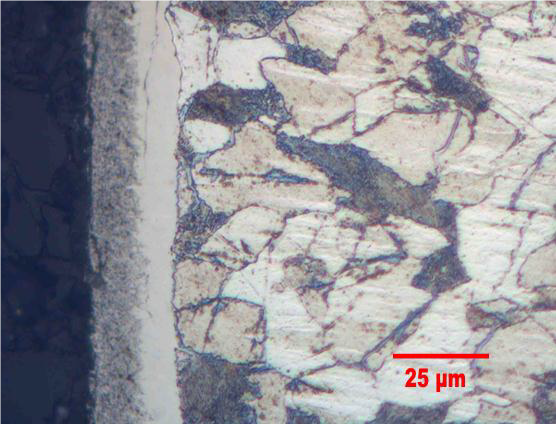 Nitrocarburizing Article - Photomicrograph of nitrocarburized 1018 steel. Etched with 3% Nital.